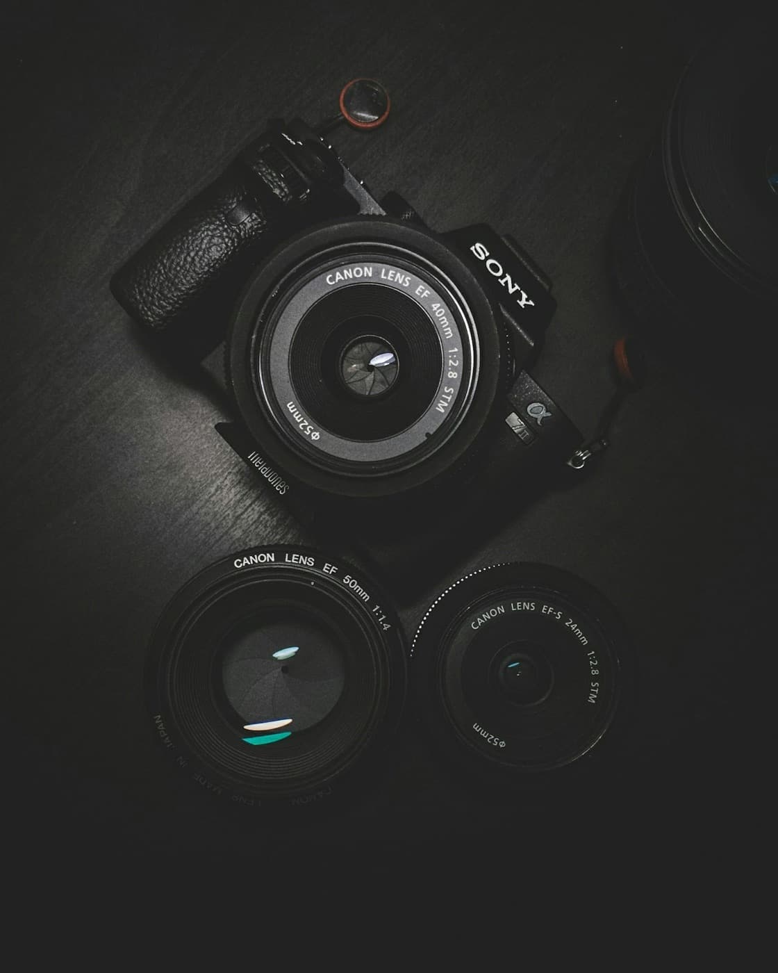 Sony mirrorless camera with two spare lenses